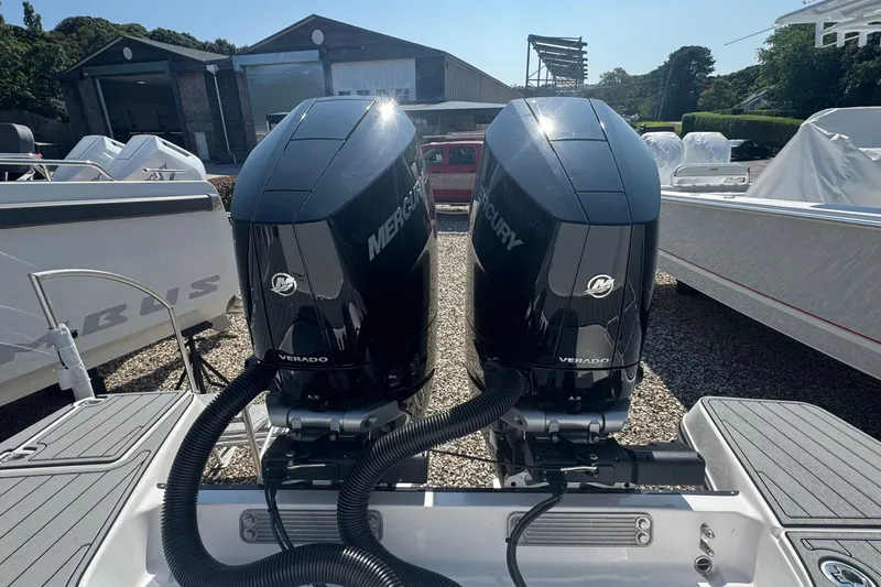 Slide: The Image of 2025 Edgewater 340CC boat with dual Mercury outboard engines on display. - 8