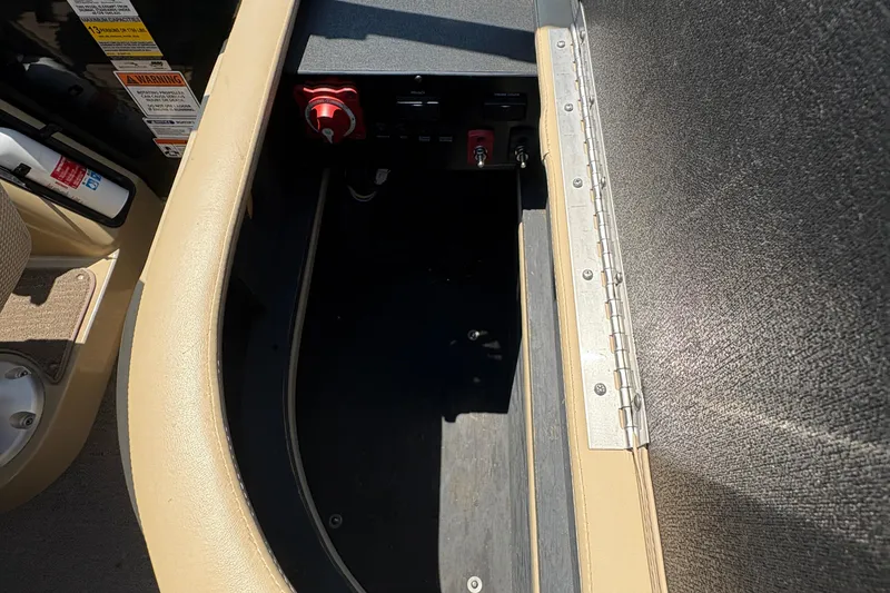 Slide: The Image of Interior view of a 2012 Bennington 2575 QCW I/O boat compartment with control panel. - 26