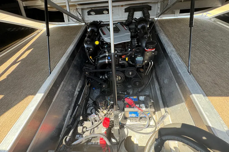 Slide: The Image of Engine compartment of a 2012 Bennington 2575 QCW I/O boat, showing detailed components. - 28