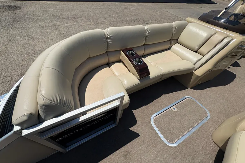 Slide: The Image of Luxurious seating on 2012 Bennington 2575 QCW I/O pontoon boat with cup holders. - 8