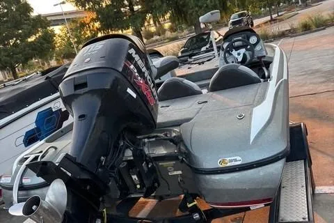 Slide: The Image of 2014 Nitra Boats Z6 with powerful outboard motor, parked on a trailer. - 3