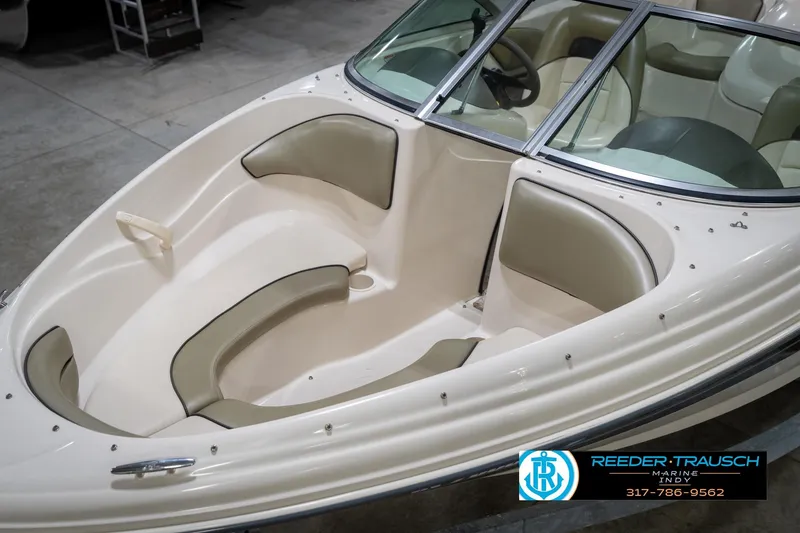 Slide: The Image of 2005 Sea Ray 180 Sport boat on trailer in indoor showroom. - 12