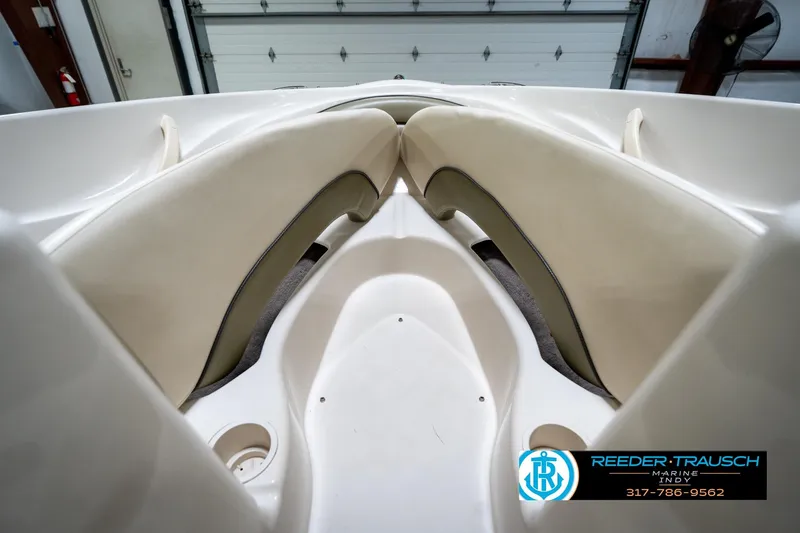 Slide: The Image of Interior view of 2005 Sea Ray 180 Sport boat with cushioned seating. - 23