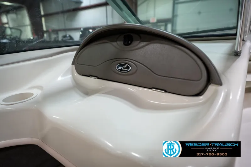 Slide: The Image of Interior view of a 2005 Sea Ray 180 Sport boat, showcasing seating and design. - 24