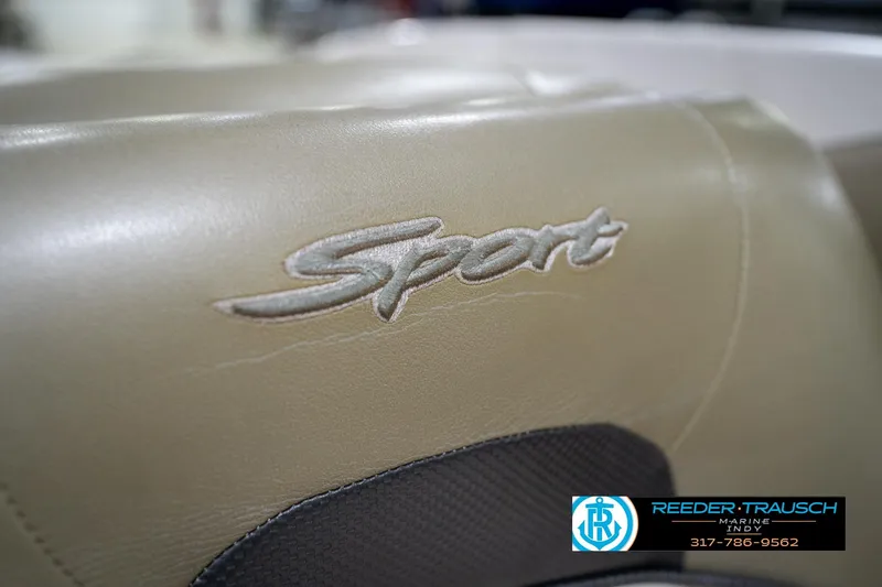 Slide: The Image of 2005 Sea Ray 180 Sport boat interior with beige and white seating. - 35