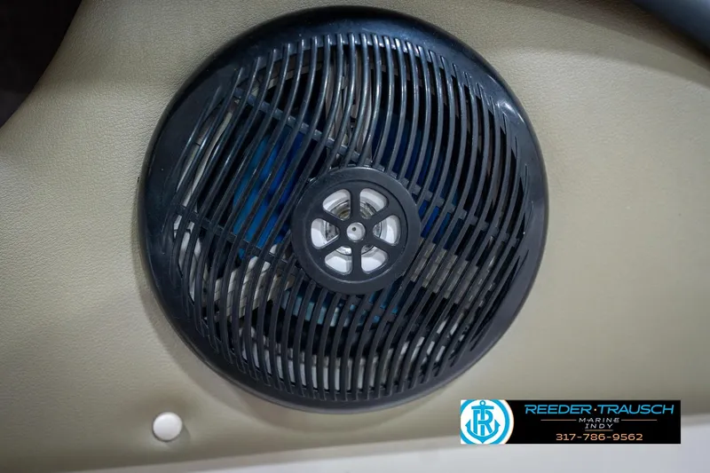 Slide: The Image of Interior view of a 2005 Sea Ray 180 Sport boat with beige seating. - 38