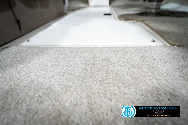 Slide: The Image of Cup holder and warning labels on 2005 Sea Ray 180 Sport boat dashboard. - 40