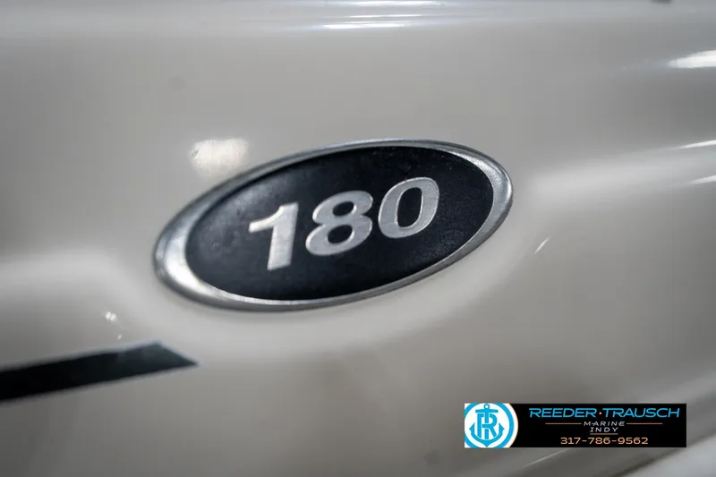 Slide: The Image of 2005 Sea Ray 180 Sport boat with "Sport" logo and Reeder-Trausch Marine branding. - 44