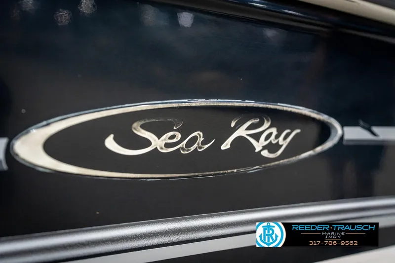 Slide: The Image of Close-up of 2005 Sea Ray 180 Sport boat emblem with Reeder-Trausch Marine logo. - 45
