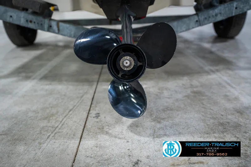 Slide: The Image of 2005 Sea Ray 180 Sport boat on trailer in indoor showroom, Reeder Trausch Marine. - 47