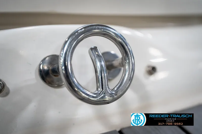 Slide: The Image of 2005 Sea Ray 180 Sport boat on trailer in indoor showroom. - 48