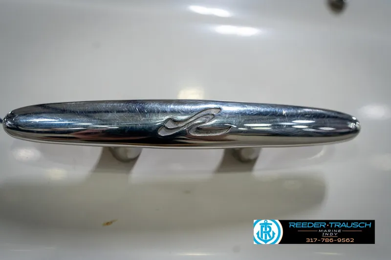 Slide: The Image of Chrome cleat on 2005 Sea Ray 180 Sport boat, Reeder Trausch Marine logo visible. - 49