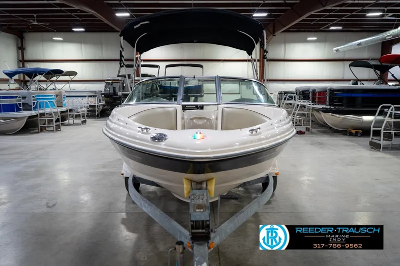 Slide: The Image of 2005 Sea Ray 180 Sport boat on trailer in indoor showroom. - 5