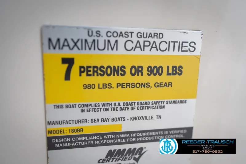 Slide: The Image of Sea Ray 180 Sport 2005 capacity label: 7 persons or 900 lbs, U.S. Coast Guard compliant. - 51