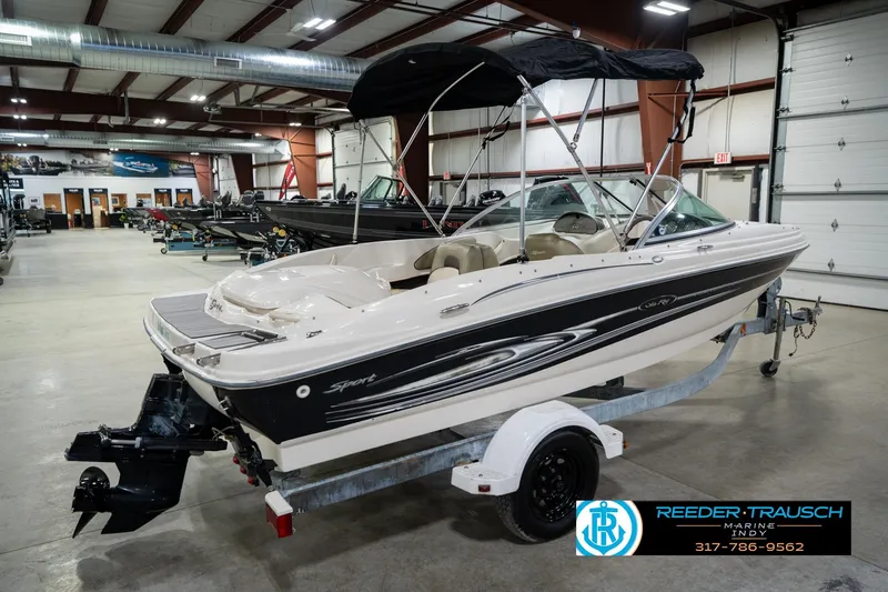 Slide: The Image of 2005 Sea Ray 180 Sport boat on trailer in indoor showroom. - 8