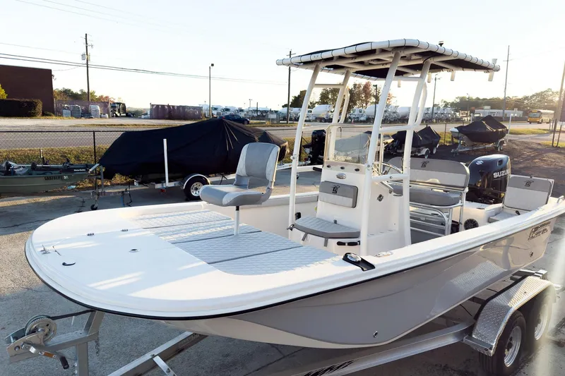 The Image of 2026 Carolina Skiff 19 LS boat on trailer, featuring center console and seating. - 1