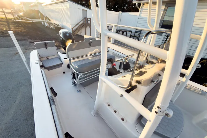 Slide: The Image of 2026 Carolina Skiff 19 LS boat interior with seating and steering console. - 14