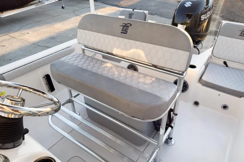 Slide: The Image of 2026 Carolina Skiff 19 LS boat interior with seating and steering wheel. - 19