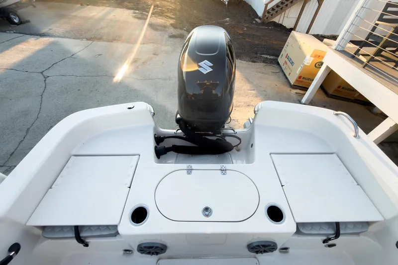 Slide: The Image of 2026 Carolina Skiff 19 LS boat with Suzuki outboard motor, rear deck view. - 26
