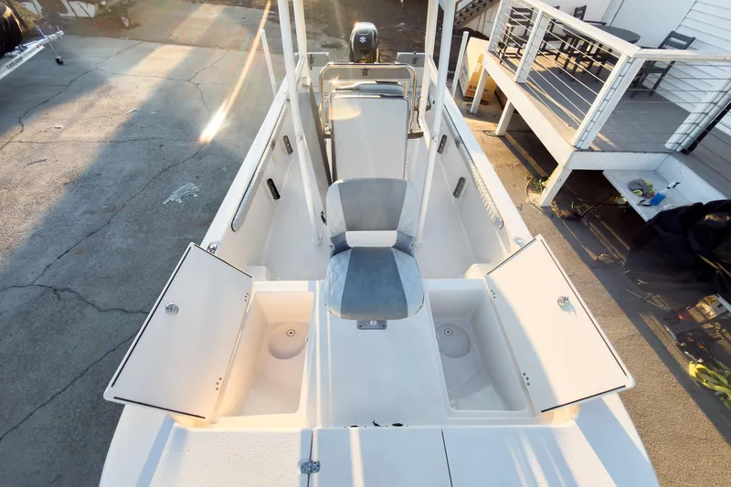 Slide: The Image of 2026 Carolina Skiff 19 LS boat interior with open storage compartments and seating. - 29