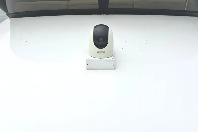 Slide: The Image of 2024 Regal 42 FXO boat with mounted security camera on deck. - 11