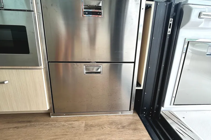 Slide: The Image of Stainless steel appliances in 2024 Regal 42 FXO yacht interior kitchen. - 21