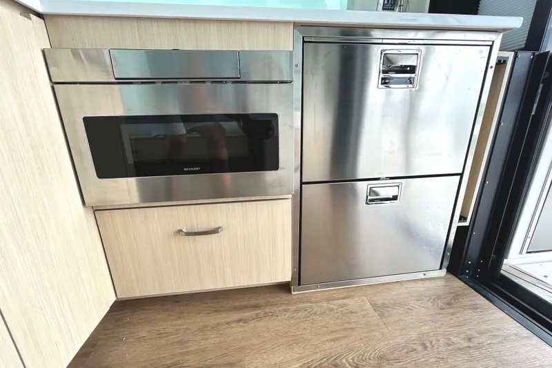 Slide: The Image of Modern kitchen appliances in 2024 Regal 42 FXO yacht interior. - 23