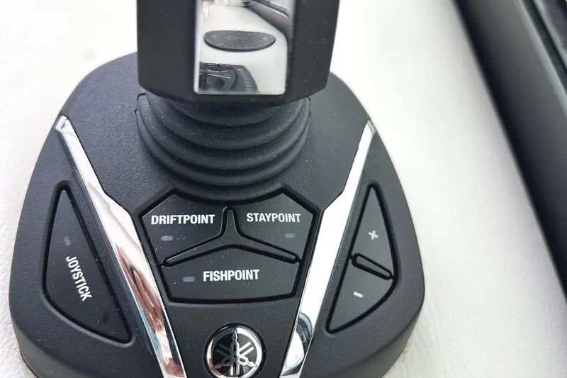 Slide: The Image of Joystick control panel on 2024 Regal 42 FXO boat with DriftPoint and FishPoint features. - 28