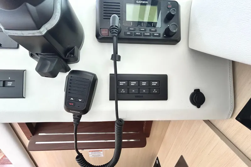 Slide: The Image of Control panel of 2024 Regal 42 FXO boat with Garmin radio and Yamaha controls. - 29