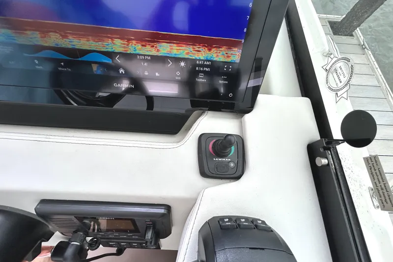 Slide: The Image of 2024 Regal 42 FXO helm with Garmin display and Lewmar joystick control. - 33