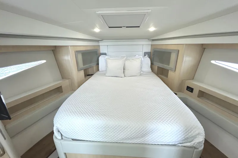 Slide: The Image of Luxurious cabin interior of 2024 Regal 42 FXO yacht with cozy bed and modern design. - 40