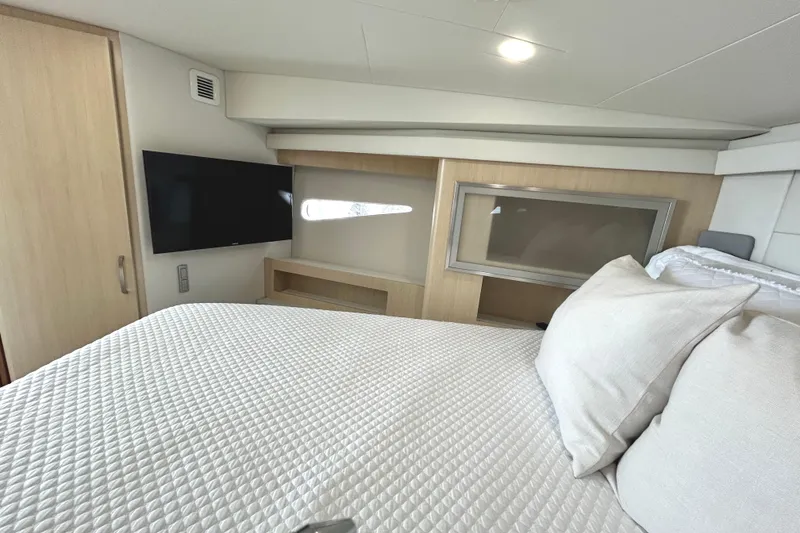 Slide: The Image of Luxurious bedroom interior of 2024 Regal 42 FXO yacht with modern amenities. - 41