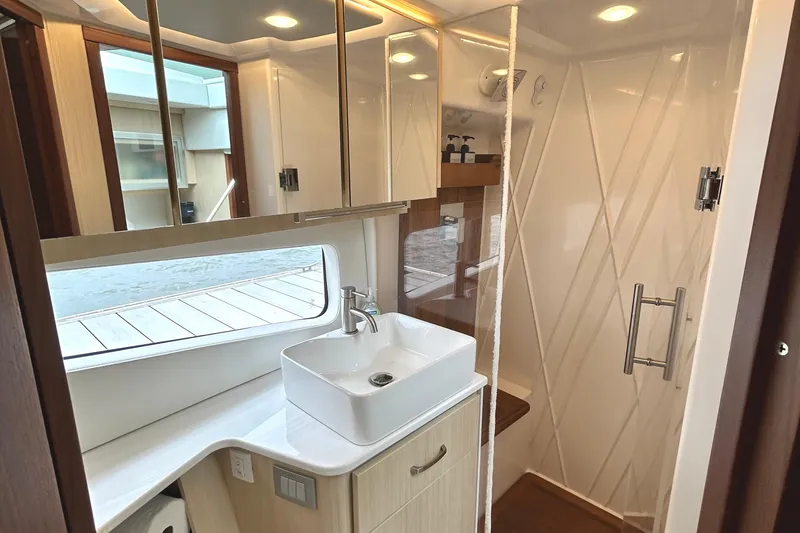 Slide: The Image of Luxurious bathroom interior of 2024 Regal 42 FXO yacht with modern fixtures and elegant design. - 44
