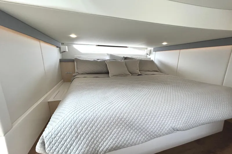 Slide: The Image of Luxurious bedroom interior of 2024 Regal 42 FXO yacht with elegant bedding and modern design. - 45