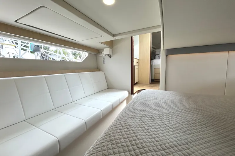 Slide: The Image of Luxurious interior of 2024 Regal 42 FXO yacht with modern seating and bedding. - 46