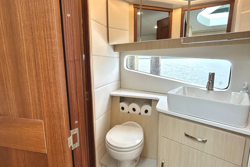 Slide: The Image of Luxurious bathroom interior of 2024 Regal 42 FXO yacht with modern fixtures and ocean view. - 47