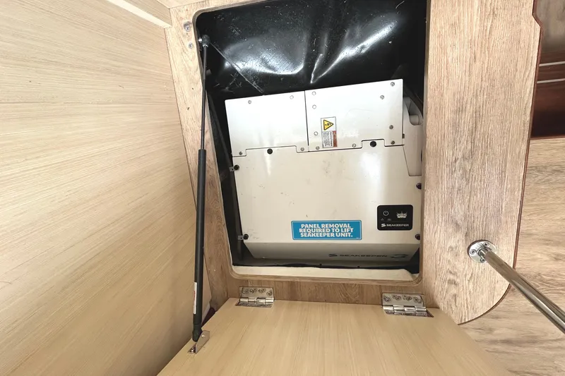 Slide: The Image of Seakeeper unit in 2024 Regal 42 FXO yacht, panel removal required for access. - 49