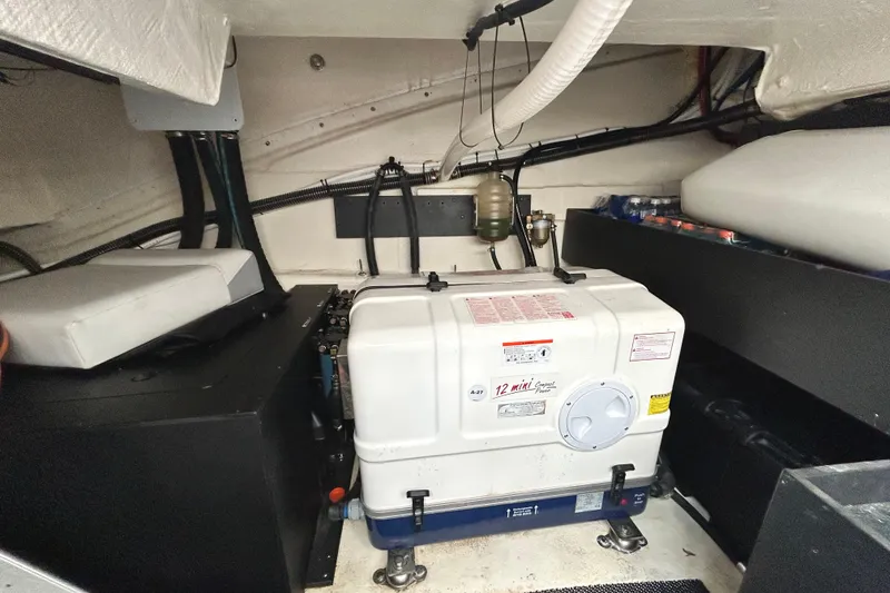 Slide: The Image of Engine room of 2024 Regal 42 FXO boat with generator and equipment. - 50