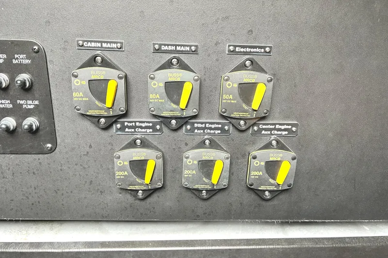 Slide: The Image of Electrical panel of a 2024 Regal 42 FXO boat with labeled circuit breakers. - 55