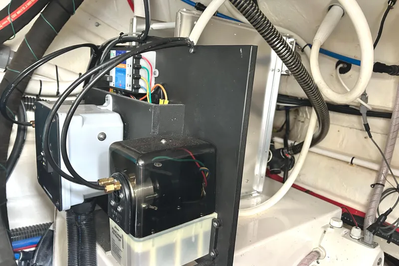 Slide: The Image of Engine compartment of 2024 Regal 42 FXO boat, showcasing wiring and components. - 56