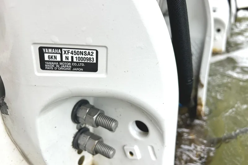 Slide: The Image of Close-up of Yamaha XF450NSA2 engine on 2024 Regal 42 FXO boat. - 59