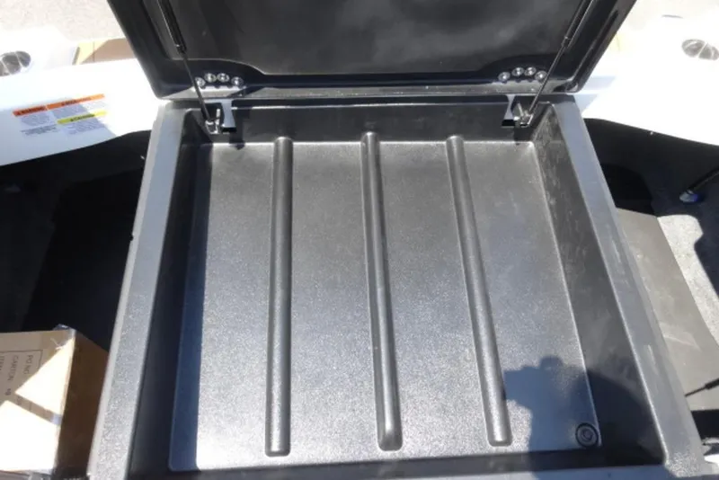 Slide: The Image of Open storage compartment in a 2025 Axis A245 boat. - 12