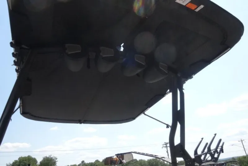 Slide: The Image of 2025 Axis A245 boat canopy with speakers and wakeboard racks. - 13