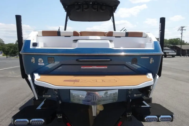 Slide: The Image of 2025 Axis A245 boat rear view with swim platform and seating. - 2