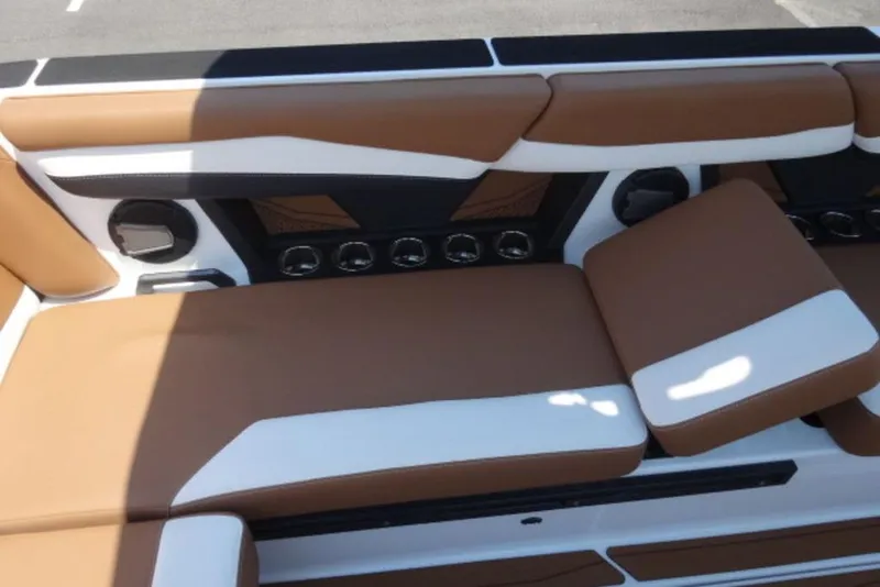 Slide: The Image of 2025 Axis A245 boat interior with brown and white cushioned seating. - 7
