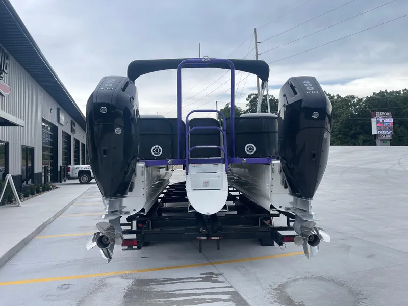 Slide: The Image of 2023 PlayCraft 3000 Infinity Extreme boat with dual engines on a trailer. - 11