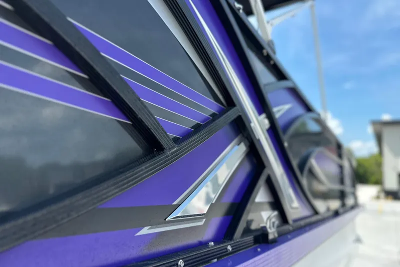 Slide: The Image of 2023 PlayCraft 2800 Extreme boat with sleek purple and black design details. - 15