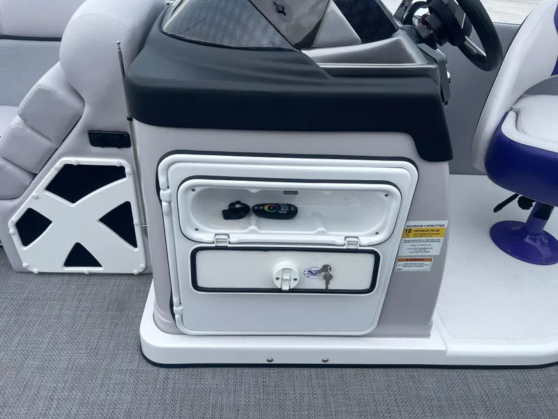 Slide: The Image of 2023 PlayCraft 3000 Infinity Extreme boat console with storage compartment and seating. - 24