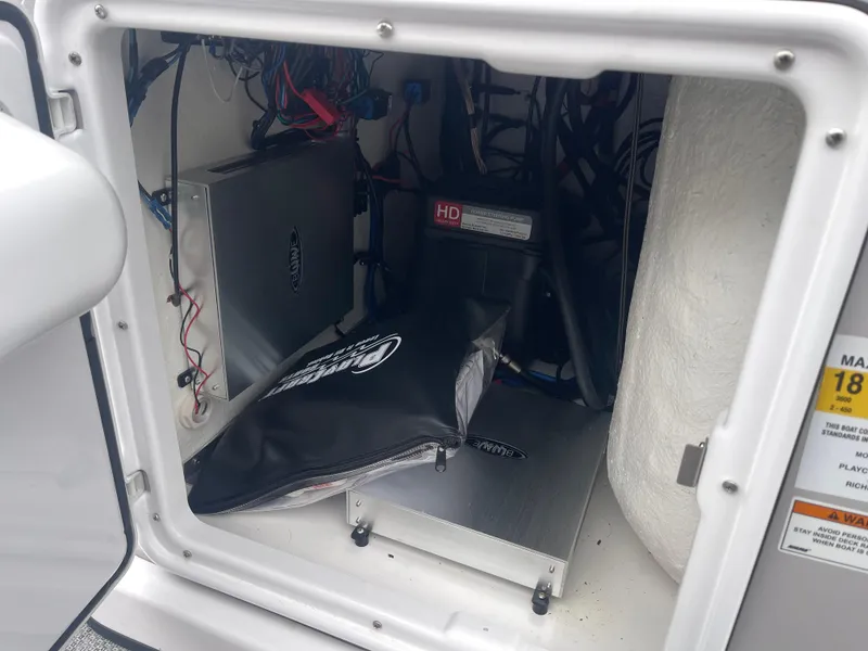 Slide: The Image of Interior view of 2023 PlayCraft 3000 Infinity Extreme boat's electrical compartment. - 25