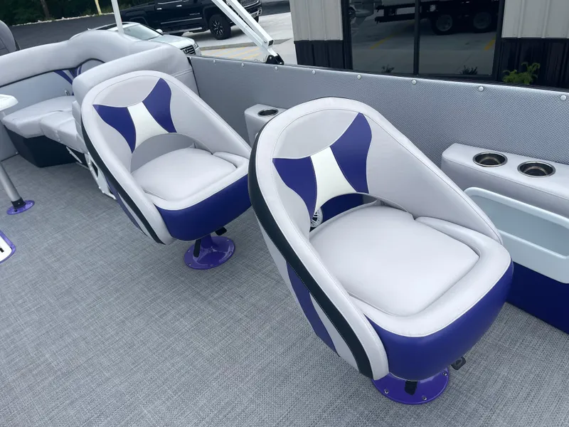 Slide: The Image of 2023 PlayCraft 3000 Infinity Extreme boat interior with stylish seating and cup holders. - 26